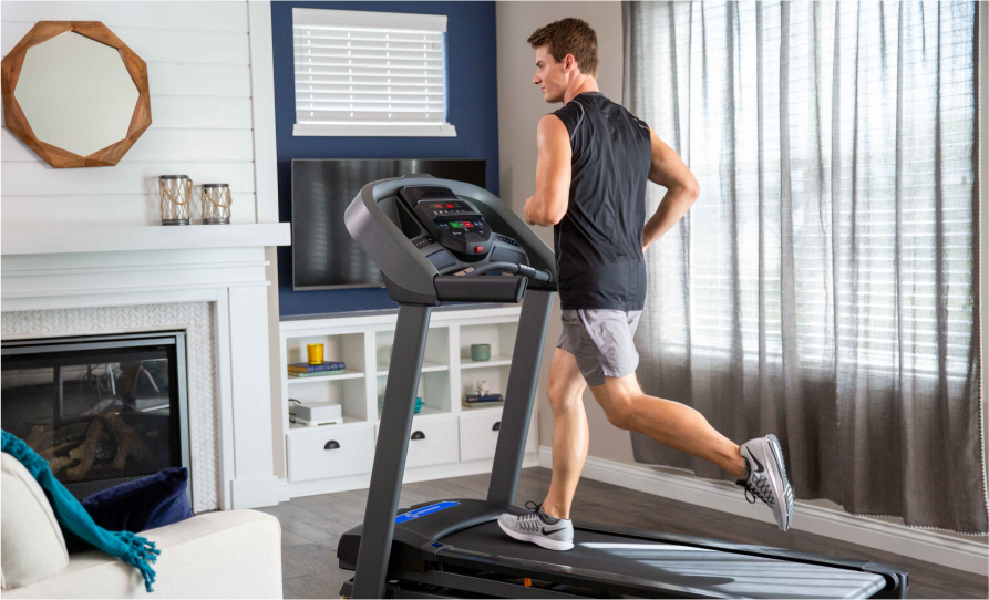 Man running on a Horizon T101 treadmill