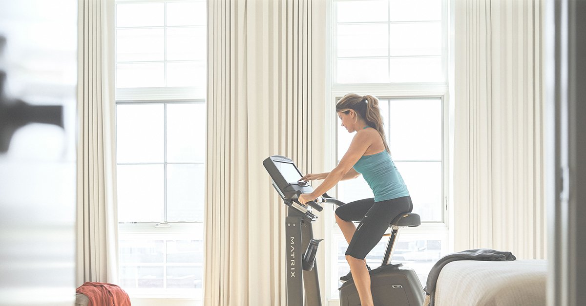 Indoor Cycling- woman on a Matrix Fitness Exercise Bike.