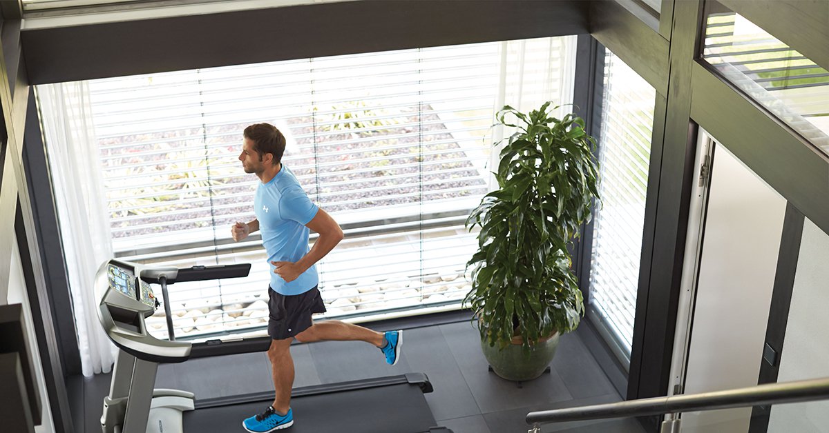 Man running on Horizon Treadmill in his home/office